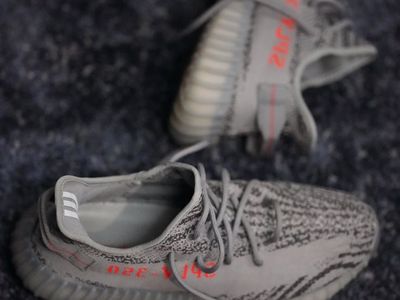 Sport shoes on a dark surface.